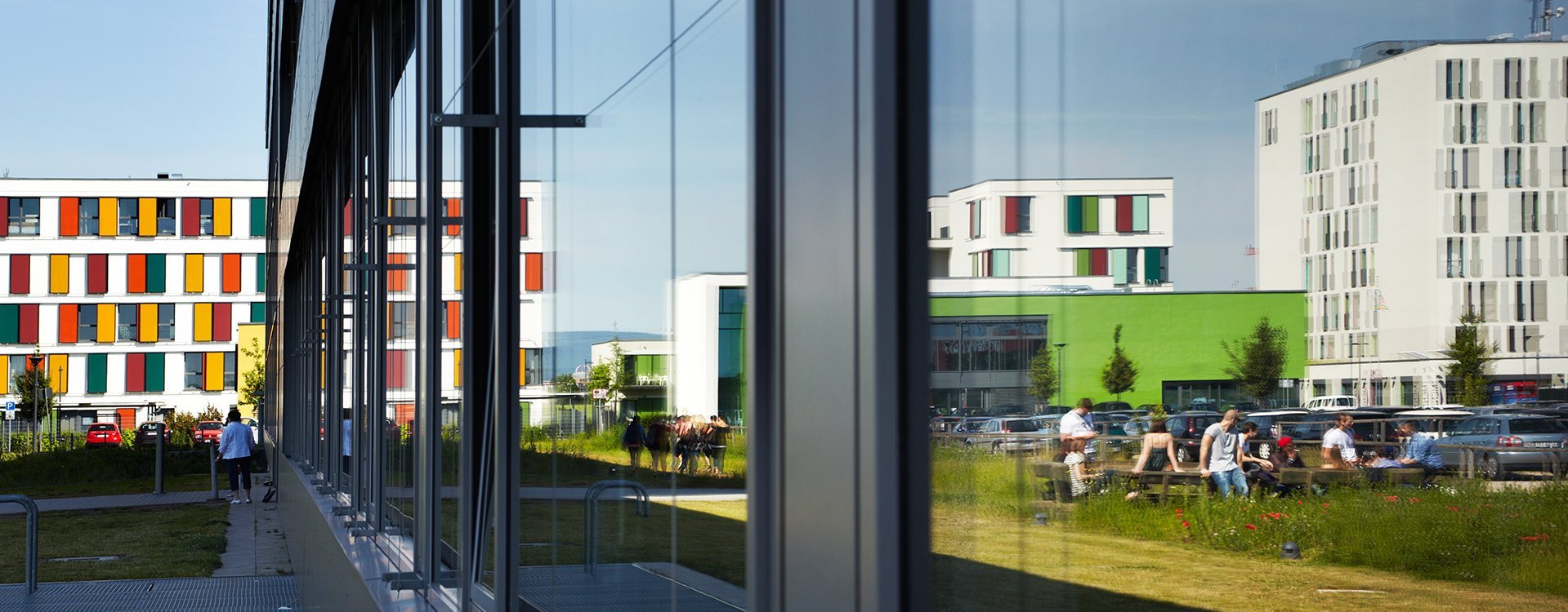 The façade on campus reflects the buildings of the student dormitories